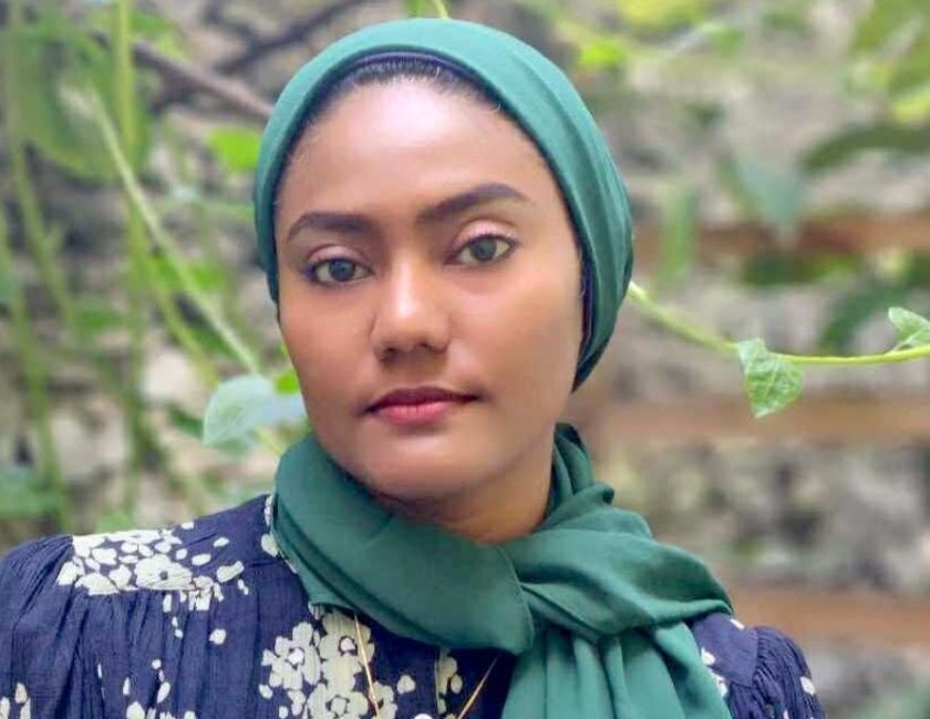 A maldivian woman in a headscarf in rainforest.