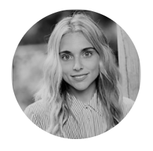 Profile photo for Marianna Lemos, Creative and Communications Advisor at Common Seas. She wears a light shirt and smiles at the camera. Photo is in greyscale.