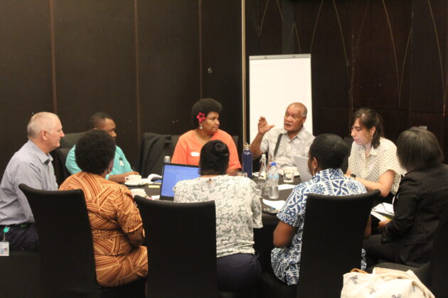 Papua New Guinea - National Action Plan workshop attendees discuss around a table