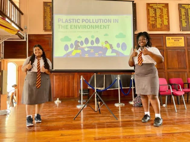 Students of the Harrison College Environmental Club present in the school auditorium